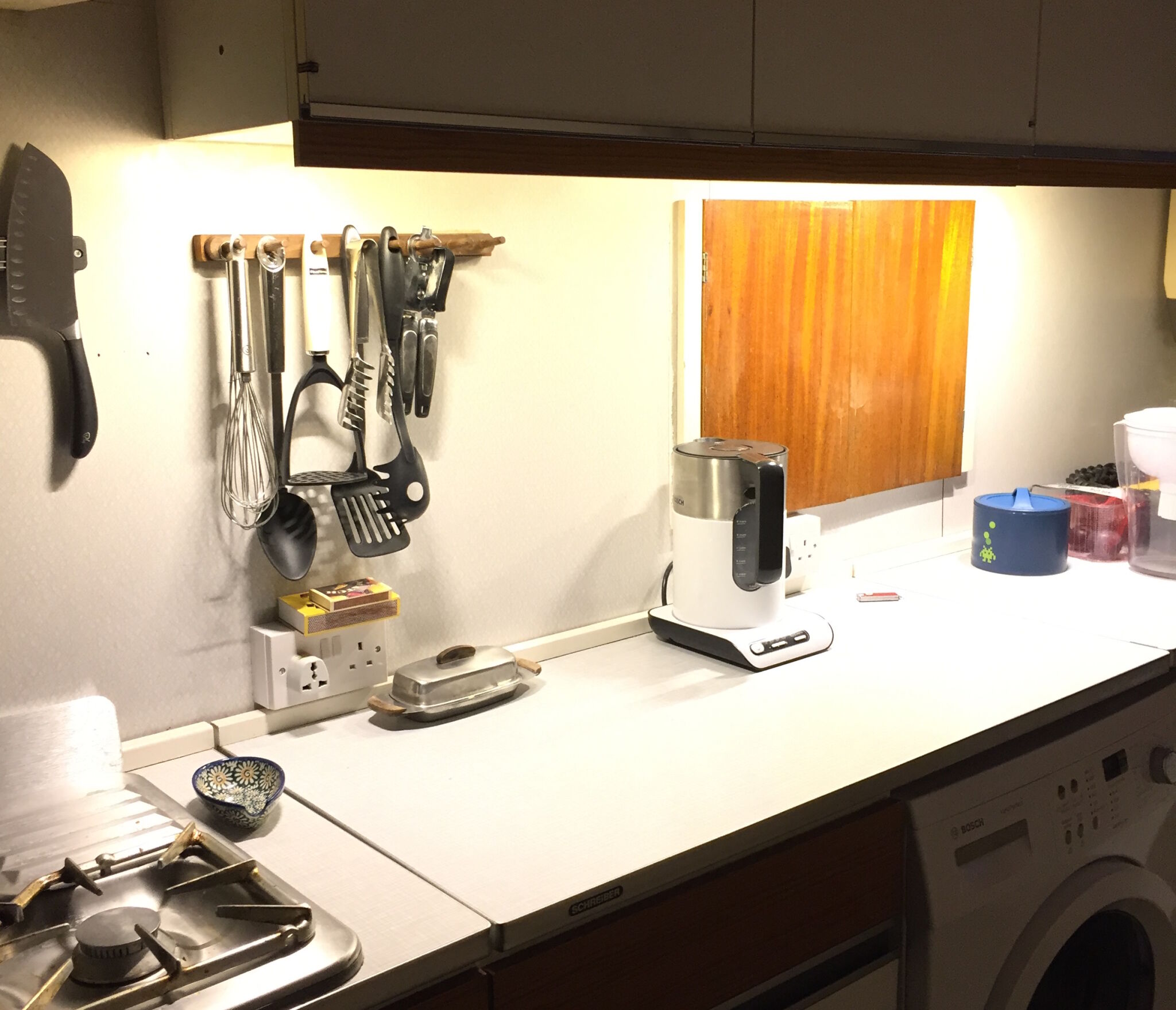  The 1970s kitchen countertop is now well-lit...